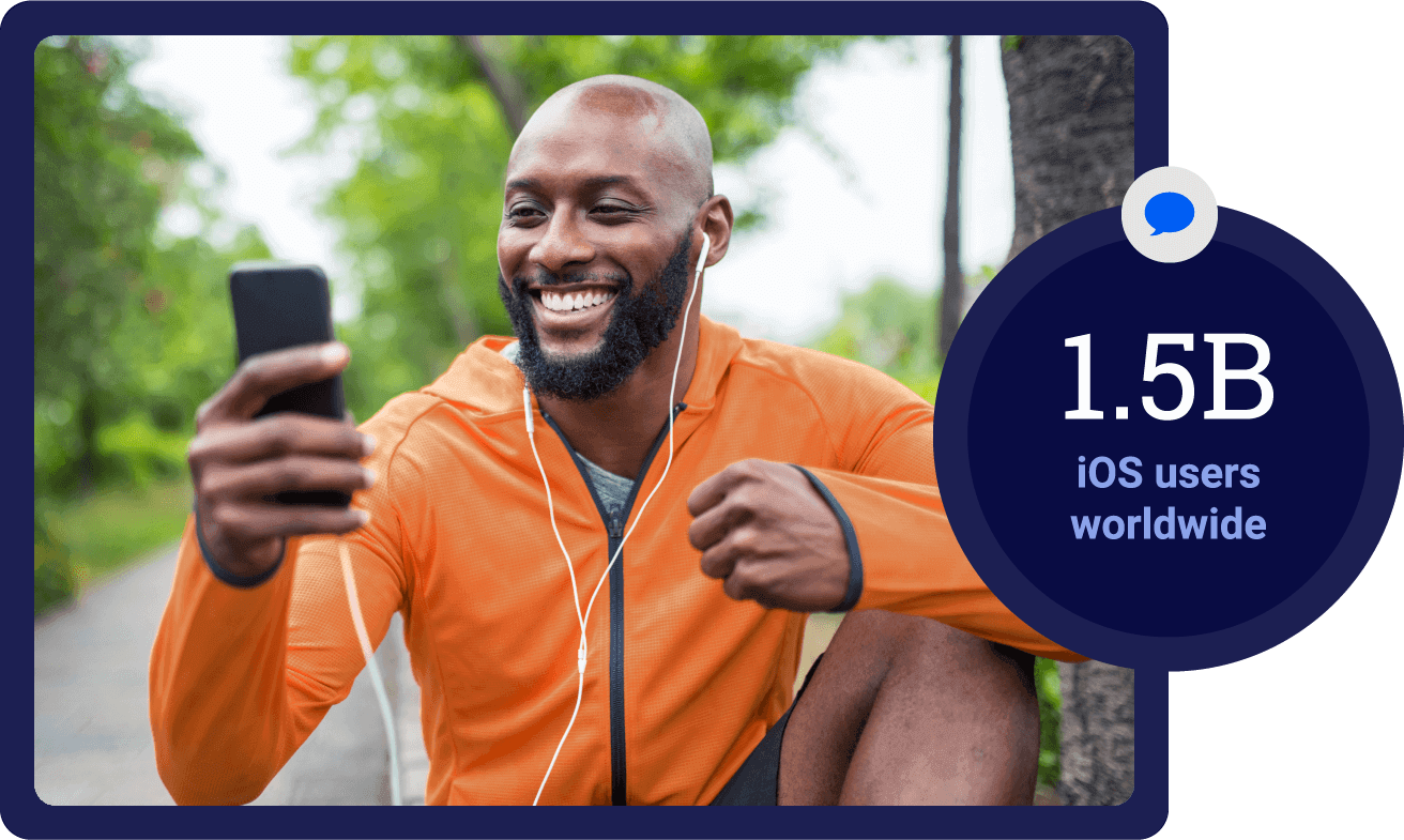 man looking at his phone and smiling with a circle superimposed to the right that says 1.5 B iOS users worldwide.