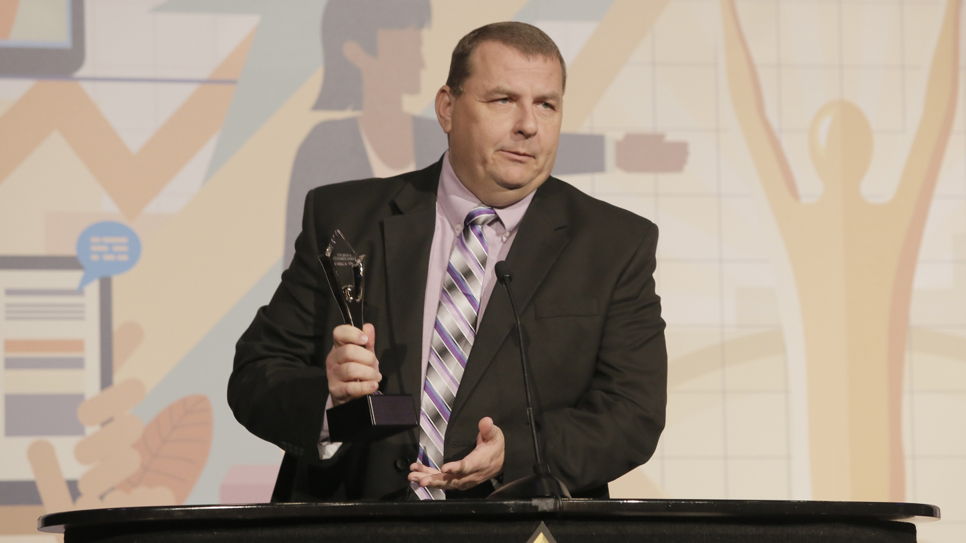 accepting Stevie Award as Best Contact Center Solution