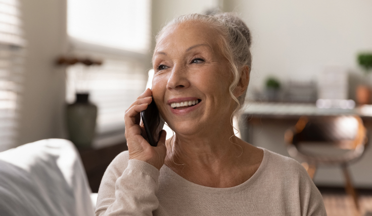 older woman using voice tech