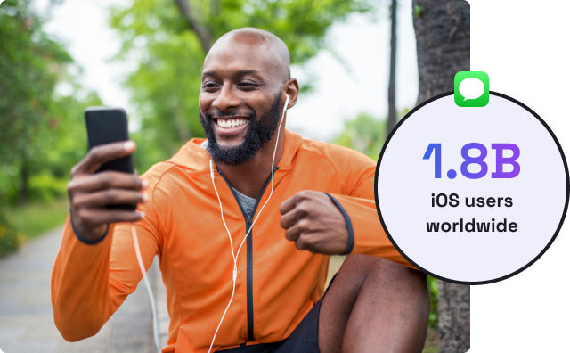 man looking at his phone and smiling with a circle superimposed to the right that says 1.8 B iOS users worldwide.