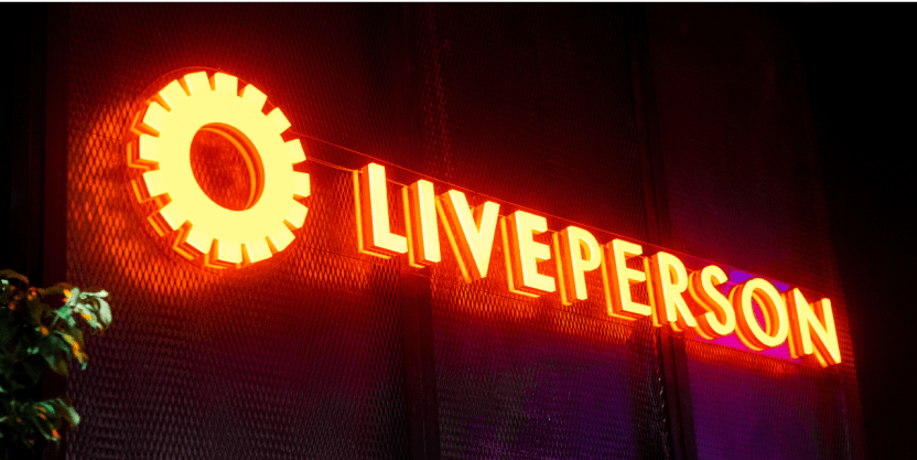 LivePerson logo in lights, representing at an event for conversational AI solutions