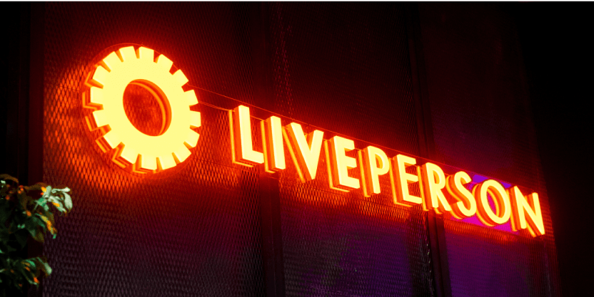 LivePerson logo in lights, representing at a conversational AI platform event